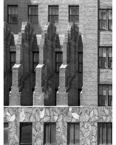 Stepped buttresses and terracotta band